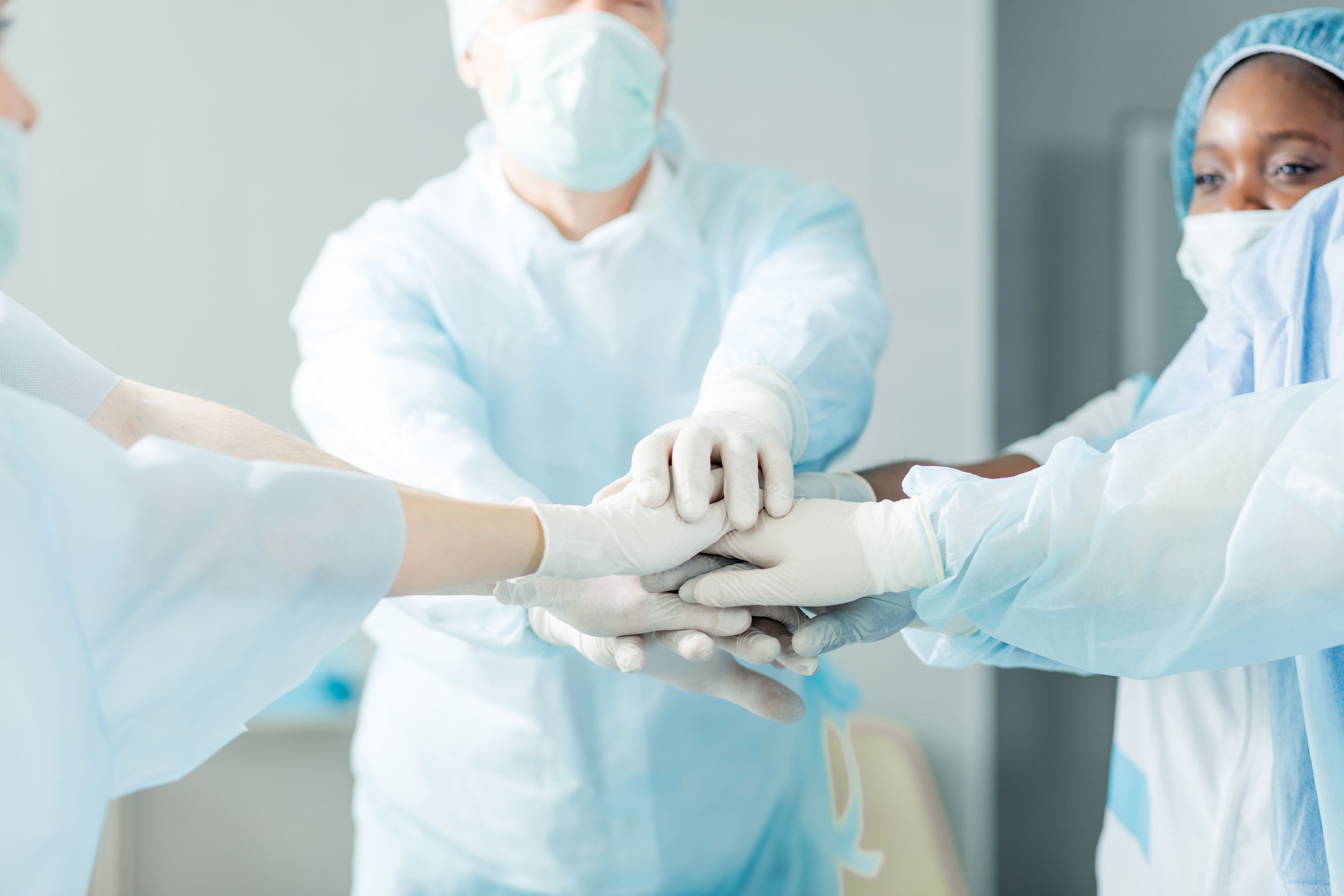 focus on doctors’ hands. team and unity concept.